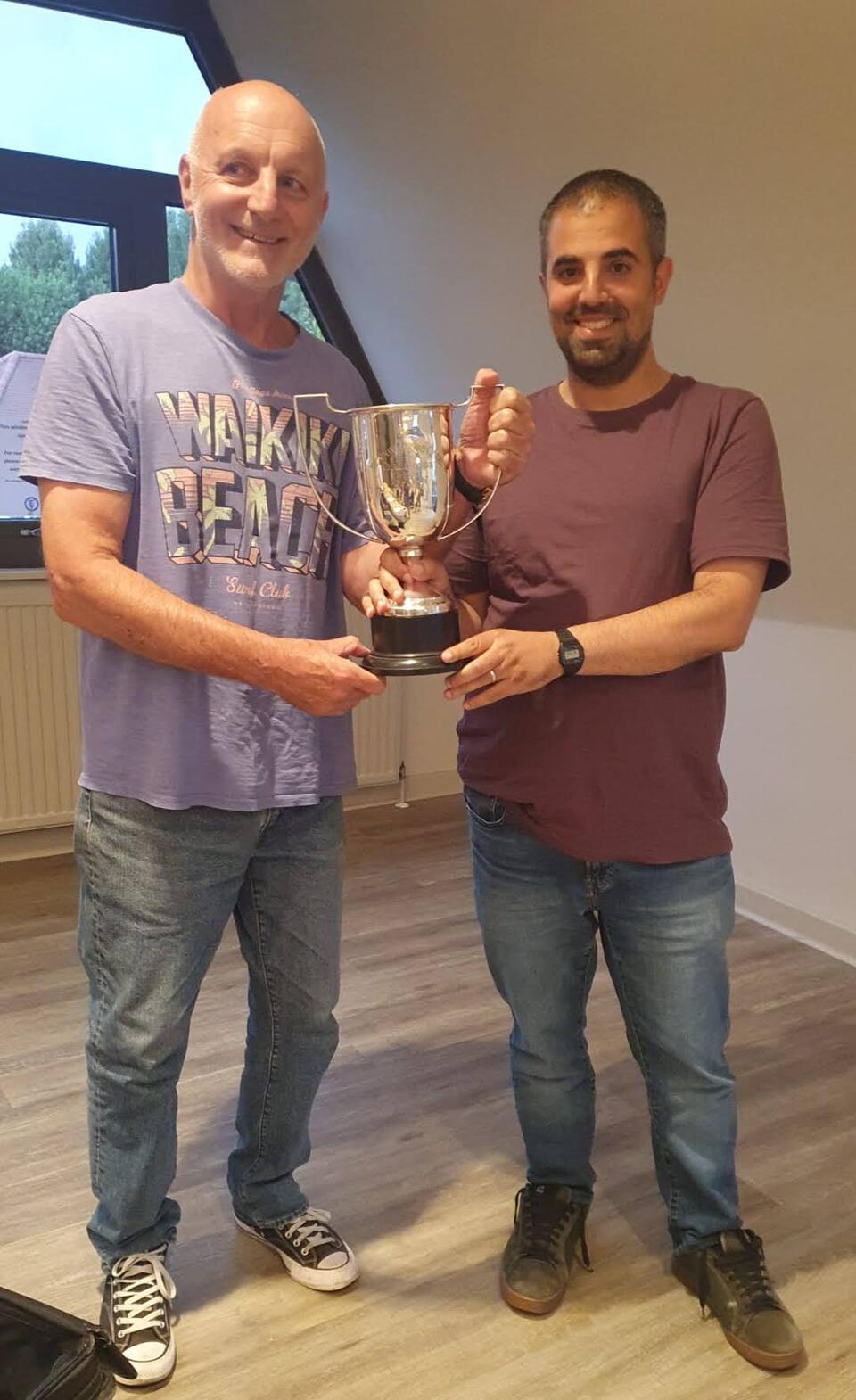 David Amior receives the trophy from Chairman Chris Rogal
